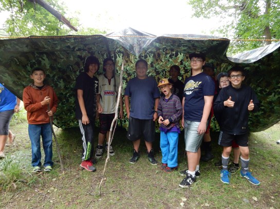 During the camp skills challenge we learned to build a shelter. The dub made us go under it and threw a bucket of water on to it to make sure it didn't leak! Thank goodness none of us got wet!
